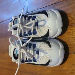 Toddler white, black, grey and blue Nike airmax sneakers.
